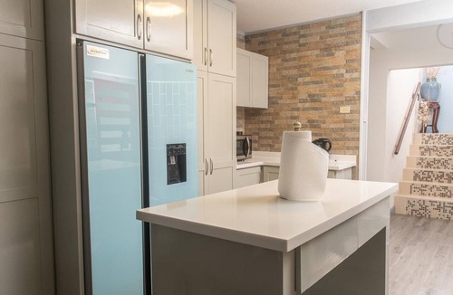 Harrismith House | Relaxing 3-bedroom home with flex-space AC and charming roof deck ocean view