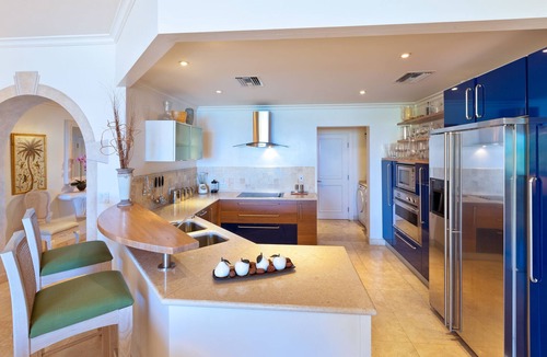 Schooner Bay Apartment | Schooner bay is a beachfront condominium with a freeform swimming pool as the focal point