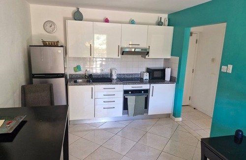 Lascelles Apartment | Stunning apartment, 4 mins walk to the beach, wifi, pool, English TV