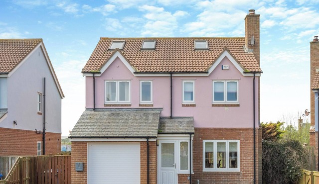 Discover coastal bliss at The Dunes, your perfect family haven by Beadnell Bay. in Beadnell