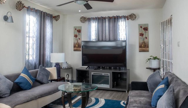 Relaxing 3-bedroom home with flex-space AC and charming roof deck ocean view
